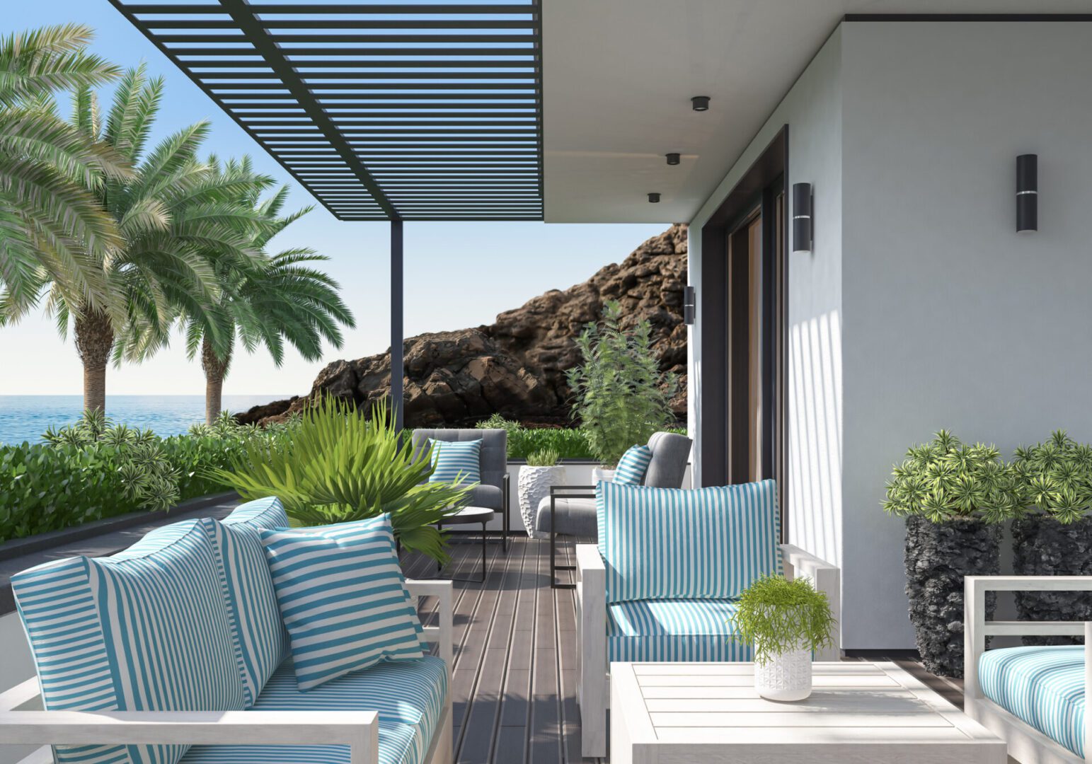 Modern patio with ocean view and seating.